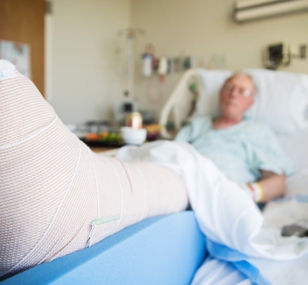 Patient-Lying-In-Hospital-Bed-With-Broken-Leg-Bone-2022-06-14-02-05-04-Utc (1)